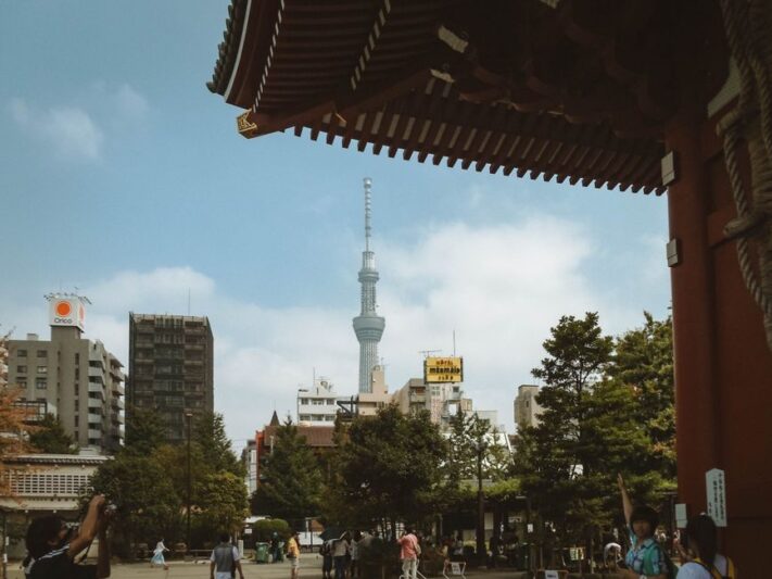 Scenic view of Tokyo Skytree framed by Senso-ji Temple architecture and city landscape.