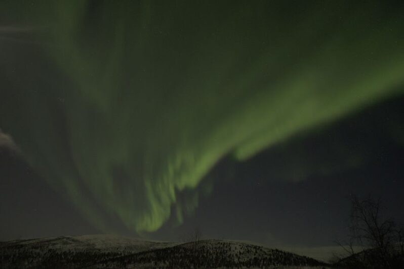 Captivating display of aurora borealis illuminating the night sky in Utsjoki, Finland.